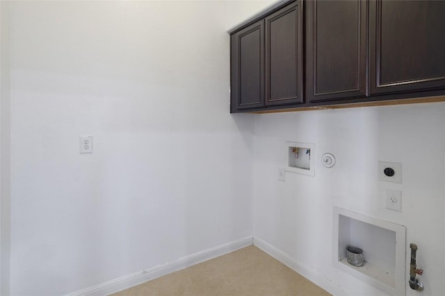 washroom featuring cabinet space, washer hookup, baseboards, hookup for a gas dryer, and hookup for an electric dryer