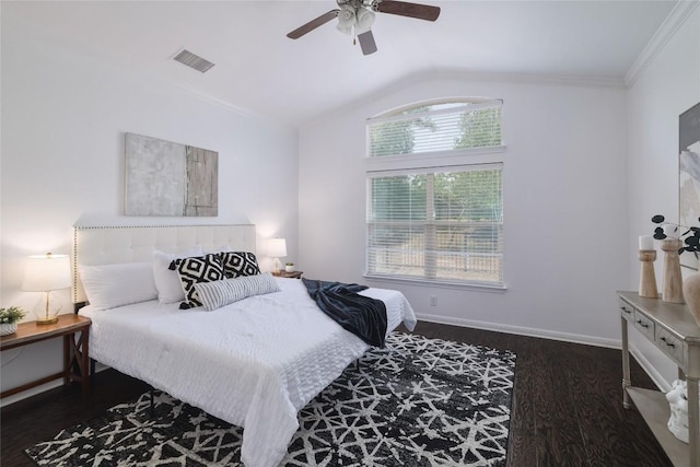 bedroom featuring a ceiling fan, wood finished floors, lofted ceiling, visible vents, and ornamental molding