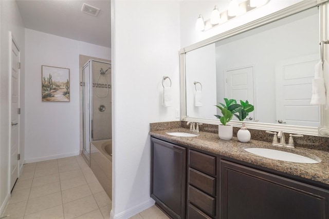 7300 Colina Vis Unit B, Austin, TX 78750 - bathroom with an enclosed shower, double vanity, tile patterned floors, and baseboards