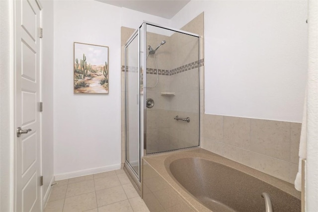 7300 Colina Vis Unit B, Austin, TX 78750 - full bathroom featuring a shower stall, a garden tub, tile patterned flooring, and baseboards