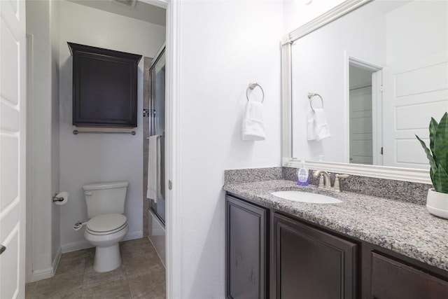 7300 Colina Vis Unit B, Austin, TX 78750 - bathroom with vanity, toilet, shower / bath combination with glass door, tile patterned flooring, and baseboards