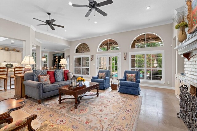 1901 Plantation Ct, Round Rock, TX 78681 - living room with ceiling fan, a fireplace, crown molding, recessed lighting, and light tile patterned floors