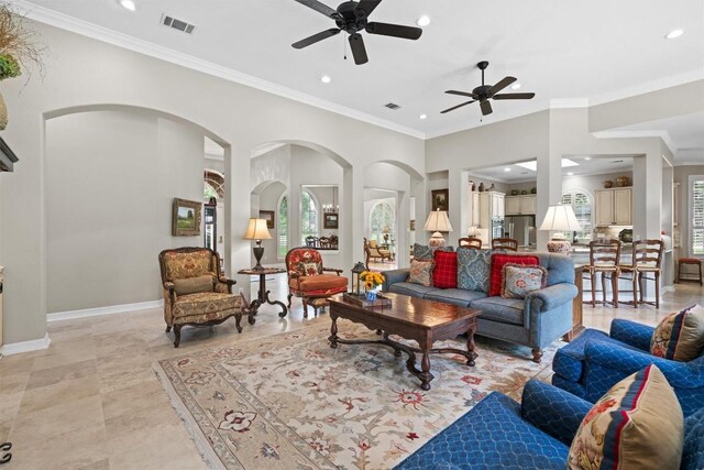 1901 Plantation Ct, Round Rock, TX 78681 - living area featuring a ceiling fan, recessed lighting, ornamental molding, baseboards, and arched walkways
