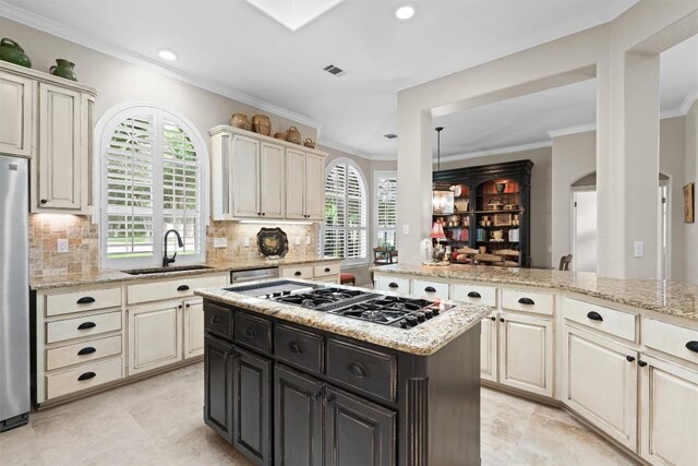 1901 Plantation Ct, Round Rock, TX 78681 - kitchen featuring a sink, stainless steel appliances, ornamental molding, recessed lighting, and backsplash