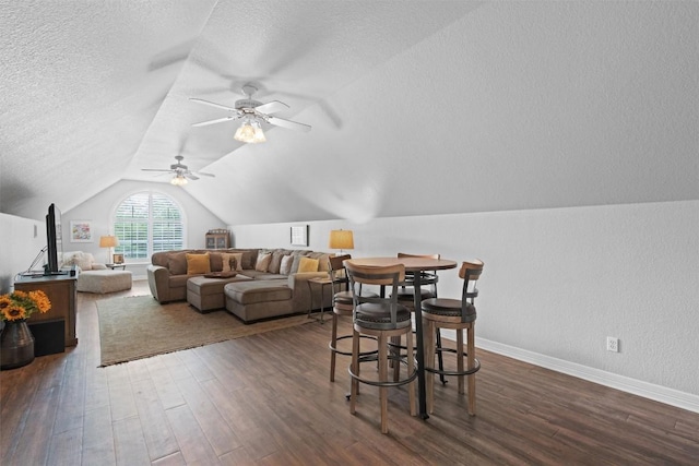 1901 Plantation Ct, Round Rock, TX 78681 - dining space featuring wood finished floors, a textured ceiling, vaulted ceiling, baseboards, and a ceiling fan