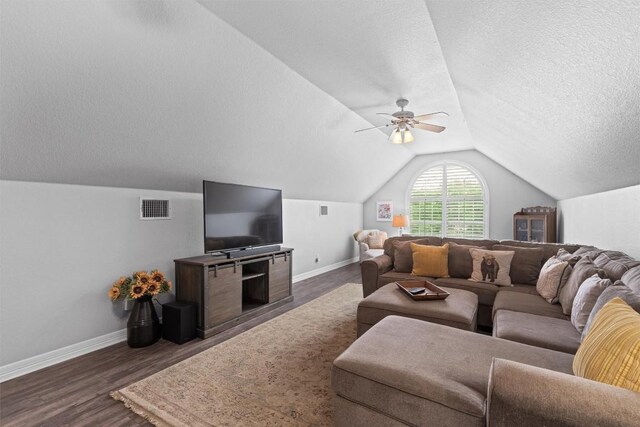 1901 Plantation Ct, Round Rock, TX 78681 - living room with baseboards, a textured ceiling, vaulted ceiling, a ceiling fan, and dark wood-style floors