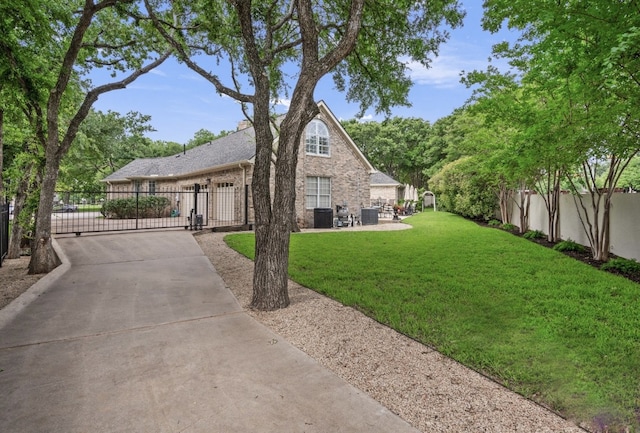 1901 Plantation Ct, Round Rock, TX 78681 - view of front of house featuring a gate, driveway, and brick siding