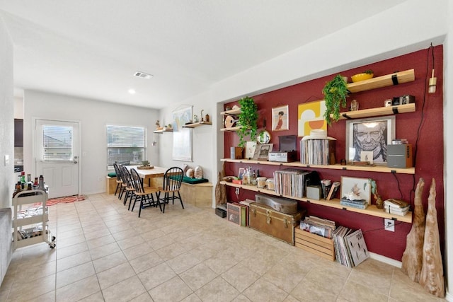dining area with tile patterned floors and visible vents