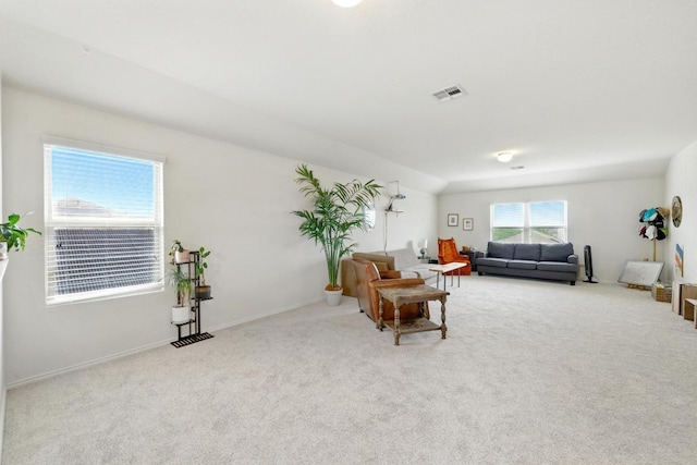 living room featuring visible vents and carpet