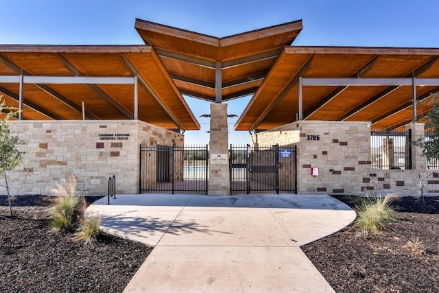 surrounding community featuring fence and a gate