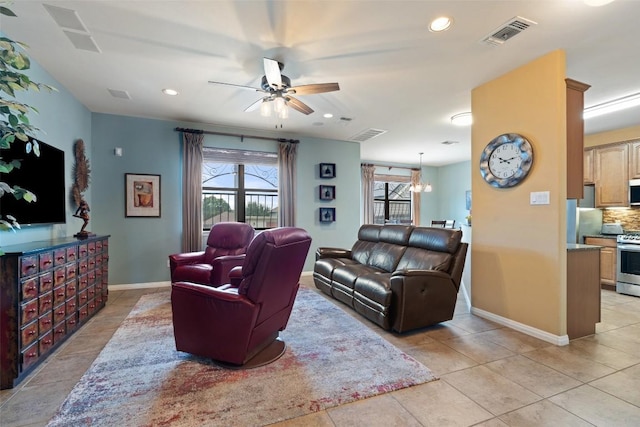 6006 Seville Dr, Austin, TX 78724 - living area with a ceiling fan, visible vents, plenty of natural light, and light tile patterned floors