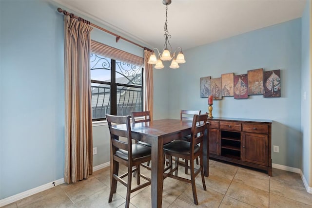 6006 Seville Dr, Austin, TX 78724 - dining area with an inviting chandelier, baseboards, and light tile patterned flooring