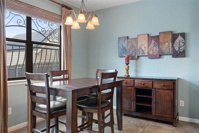 6006 Seville Dr, Austin, TX 78724 - dining space featuring an inviting chandelier and baseboards