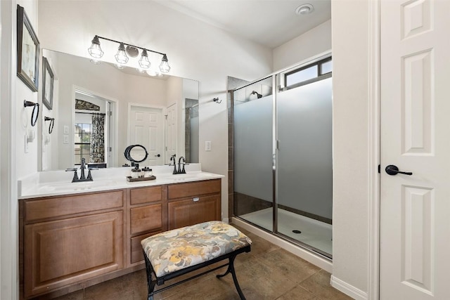 6006 Seville Dr, Austin, TX 78724 - bathroom with a shower stall, plenty of natural light, and double vanity