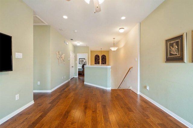 6006 Seville Dr, Austin, TX 78724 - unfurnished living room featuring wood-type flooring, a ceiling fan, and recessed lighting