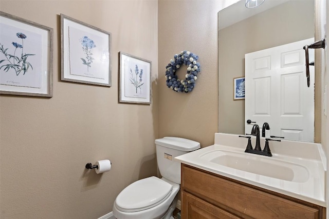 6006 Seville Dr, Austin, TX 78724 - half bathroom featuring vanity and toilet