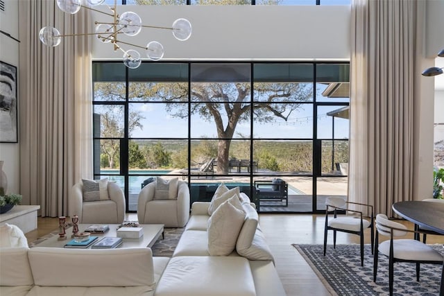 8701 Acuarela Ct, Austin, TX 78735 - living area featuring wood finished floors and a chandelier