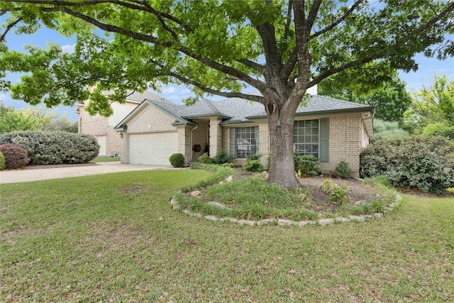 1202 Stepp Bnd, Cedar Park, TX 78613 - view of front of house featuring a garage, brick siding, driveway, and a front yard