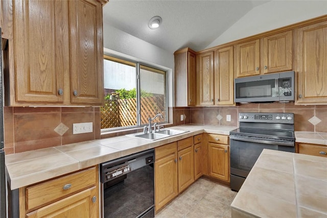 1202 Stepp Bnd, Cedar Park, TX 78613 - kitchen featuring stainless steel microwave, black dishwasher, electric range oven, a sink, and vaulted ceiling