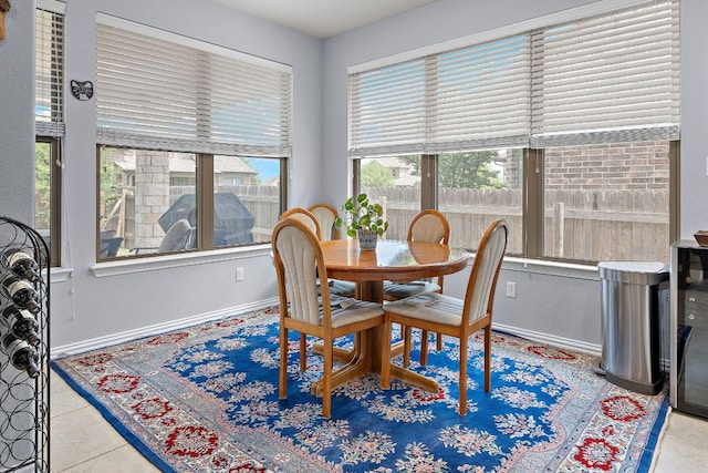 dining room featuring baseboards and tile patterned floors
