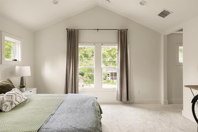 bedroom with visible vents, carpet flooring, baseboards, and lofted ceiling