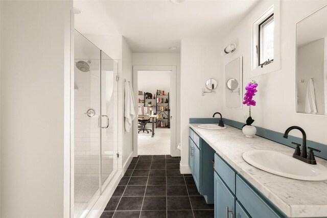 4903 Shoal Creek Blvd, Austin, TX 78756 - bathroom with double vanity, a shower stall, tile patterned flooring, and a walk in closet