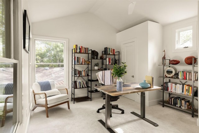 carpeted office featuring baseboards, a wealth of natural light, and lofted ceiling