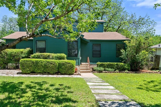 4903 Shoal Creek Blvd, Austin, TX 78756 - obstructed view of property featuring a front yard and a shingled roof