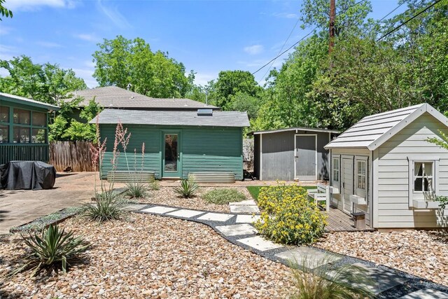4903 Shoal Creek Blvd, Austin, TX 78756 - rear view of house with an outdoor structure and a patio