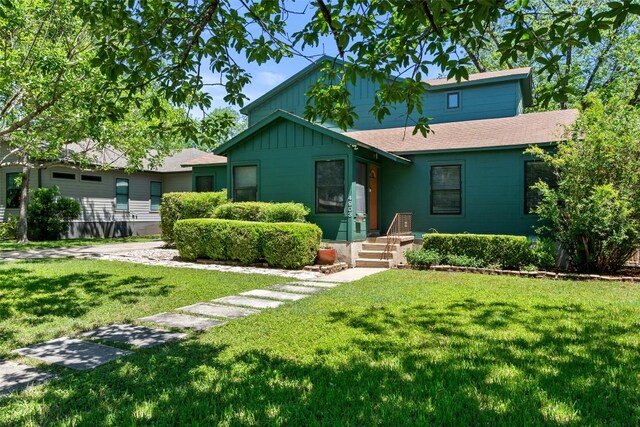 4903 Shoal Creek Blvd, Austin, TX 78756 - single story home featuring a front yard, a shingled roof, and board and batten siding