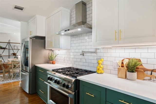 4903 Shoal Creek Blvd, Austin, TX 78756 - kitchen featuring wall chimney range hood, green cabinetry, stainless steel appliances, white cabinetry, and visible vents