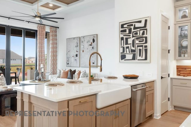 interior space featuring beam ceiling, a sink, a ceiling fan, wood finished floors, and coffered ceiling