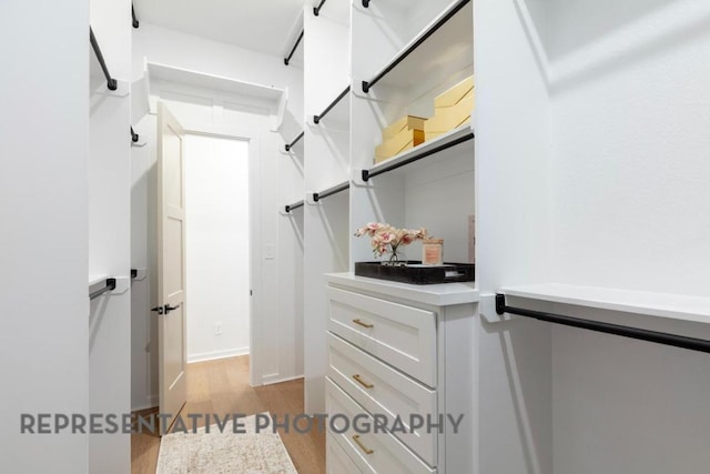 spacious closet with wood finished floors