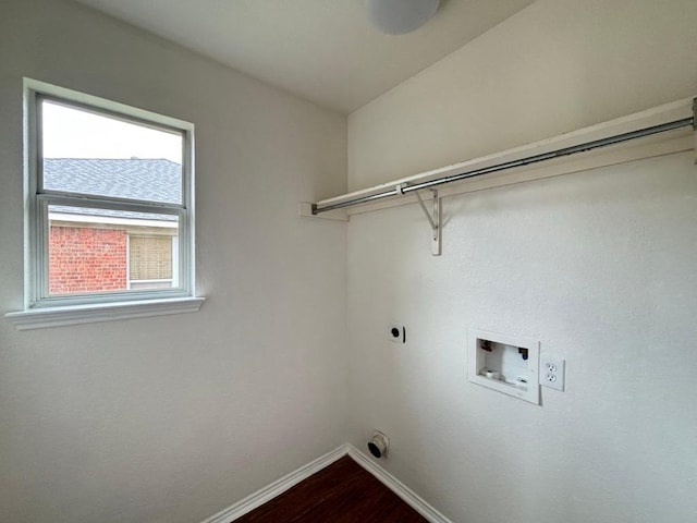 laundry area with laundry area, baseboards, hookup for a washing machine, dark wood finished floors, and hookup for an electric dryer