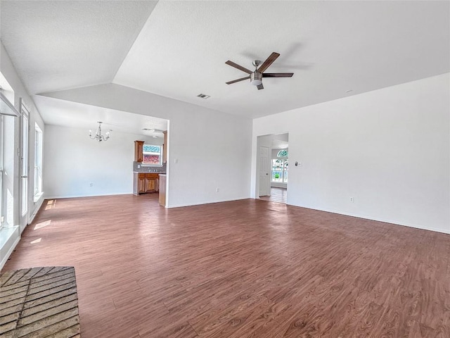 1614 Prickly Pear St, Lockhart, TX 78644 - unfurnished living room featuring a chandelier, a ceiling fan, wood finished floors, and lofted ceiling