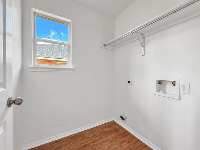 1614 Prickly Pear St, Lockhart, TX 78644 - laundry room featuring hookup for an electric dryer, wood finished floors, and washer hookup