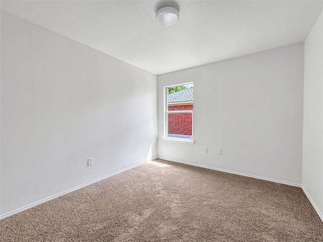 1614 Prickly Pear St, Lockhart, TX 78644 - carpeted empty room featuring baseboards
