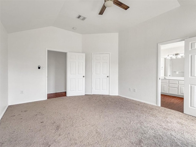 1614 Prickly Pear St, Lockhart, TX 78644 - unfurnished bedroom with carpet floors, vaulted ceiling, ensuite bathroom, and ceiling fan