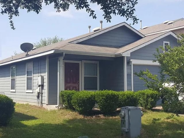 view of home's exterior featuring a garage and a yard