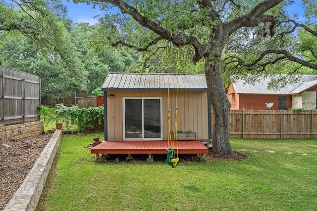view of outbuilding featuring a fenced backyard and an outdoor structure