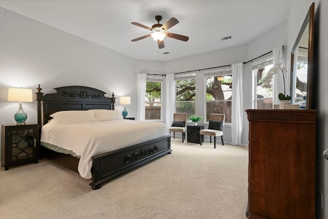 bedroom featuring ceiling fan, carpet flooring, and visible vents