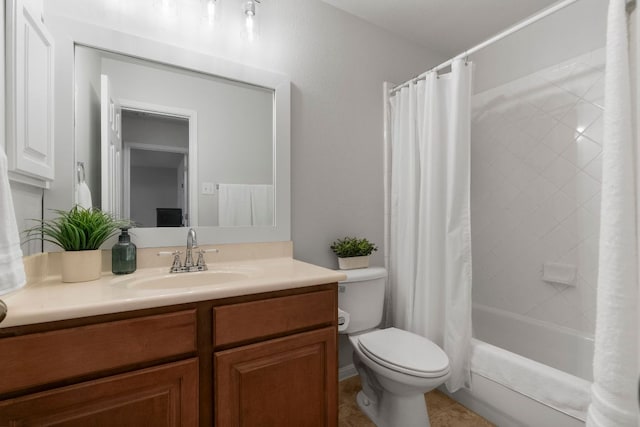 bathroom featuring vanity, tile patterned floors, shower / bath combo with shower curtain, and toilet