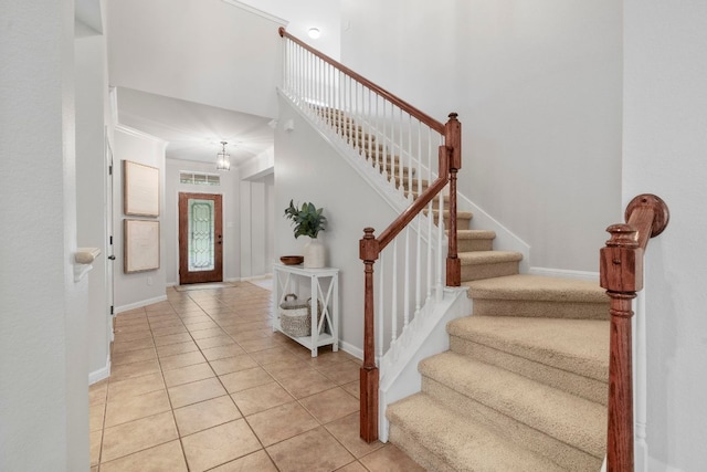 interior space with baseboards and tile patterned floors