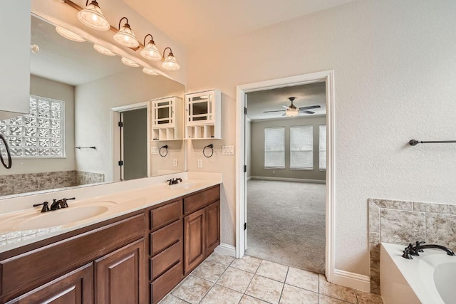 404 Scarlet Maple Dr, Cedar Park, TX 78613 - bathroom featuring a sink, tile patterned flooring, a garden tub, and double vanity
