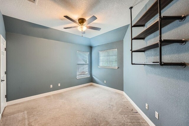404 Scarlet Maple Dr, Cedar Park, TX 78613 - unfurnished bedroom with carpet floors, a textured ceiling, and baseboards