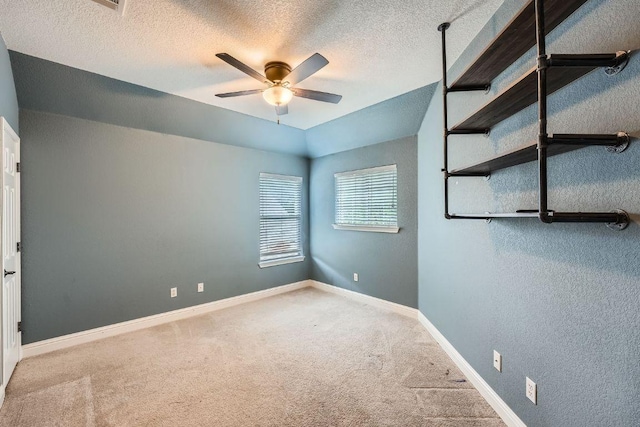 404 Scarlet Maple Dr, Cedar Park, TX 78613 - carpeted empty room with a ceiling fan, a textured ceiling, and baseboards