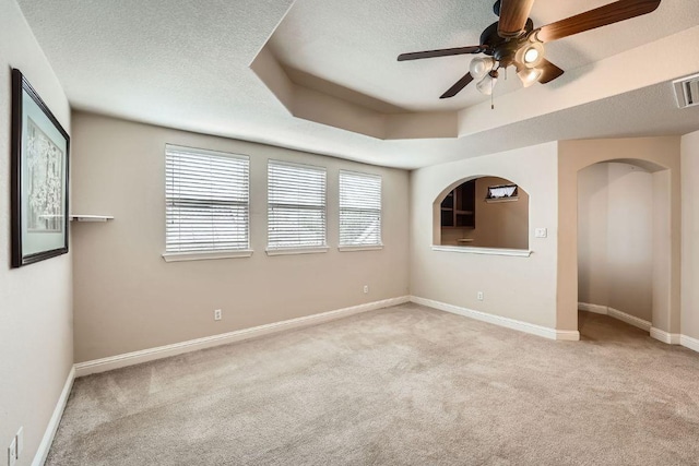 404 Scarlet Maple Dr, Cedar Park, TX 78613 - carpeted empty room with baseboards, a textured ceiling, a raised ceiling, and ceiling fan