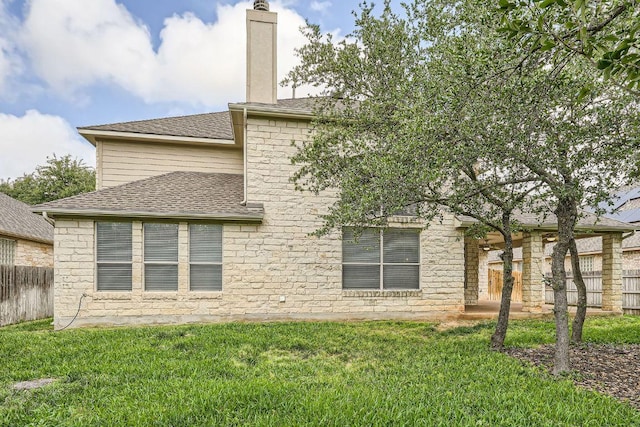 404 Scarlet Maple Dr, Cedar Park, TX 78613 - rear view of house featuring a lawn, fence, and a chimney
