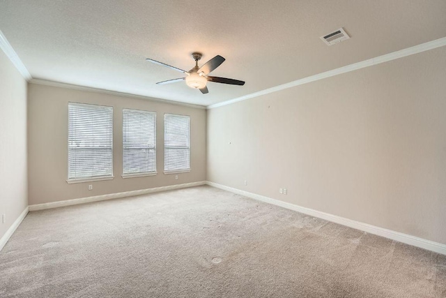 404 Scarlet Maple Dr, Cedar Park, TX 78613 - empty room featuring ceiling fan, light carpet, baseboards, visible vents, and ornamental molding