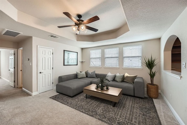 404 Scarlet Maple Dr, Cedar Park, TX 78613 - carpeted living area with visible vents, a raised ceiling, ceiling fan, and baseboards